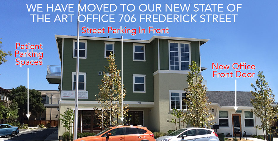 New dental office building at 706 Frederick Street with moving announcement and parking lot.